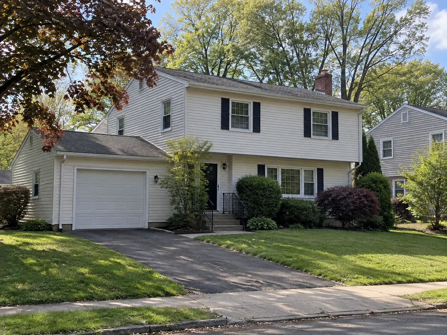 Older residential property on a neighborhood street in Meriden, Connecticut